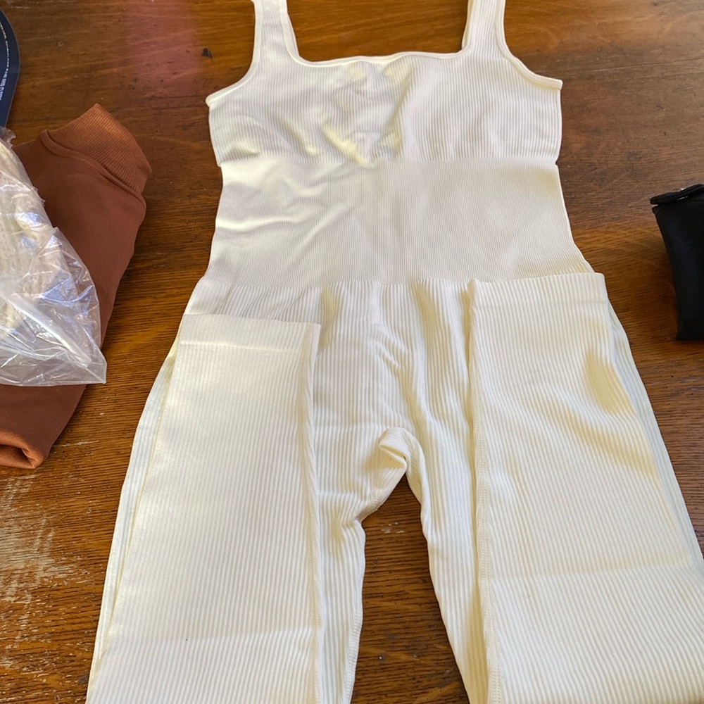 Size large white/cream romper, brand new. Would fit medium as well. Super cute